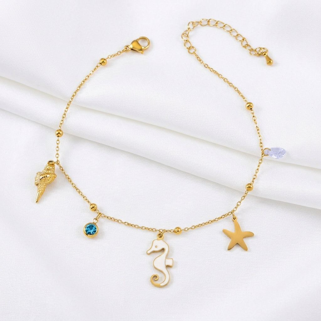 Bracelet cheville hippocampe étoile de mer doré – charmes marins fond blanc – WristArt