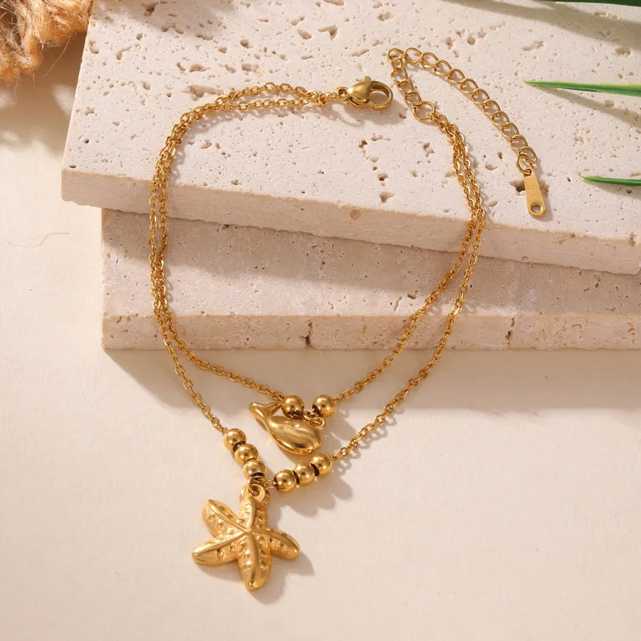 Bracelet Cheville Dauphin Étoile de Mer Tropical Acier 18K | WristArt Doré