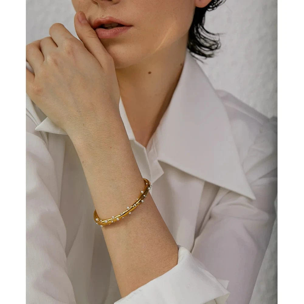 bracelet jonc acier doré perles blanches