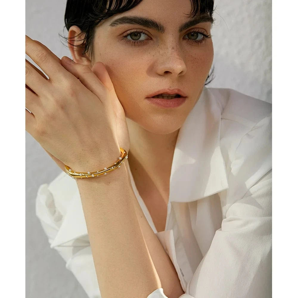 bracelet jonc acier doré perles blanches